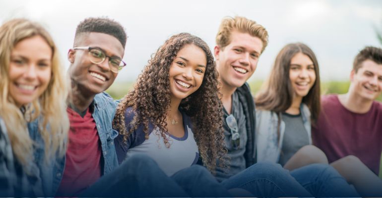 Group of 6 teens smiling at the camera