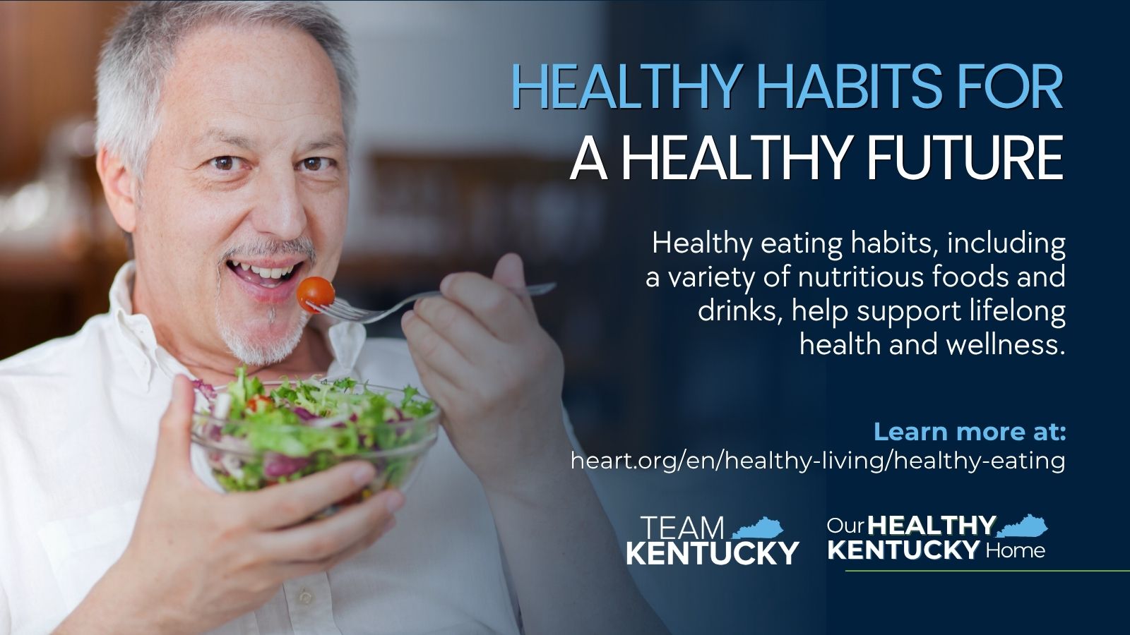 A man smiling at the camera as he takes a bite of his salad he is holding